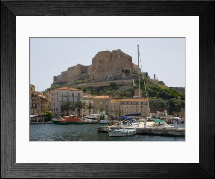 Framed Print : France, Corsica. Walled citadel enclosing the old city rises above the inner harbor at Bonifacio Framed Print : France, Corsica. Walled citadel enclosing the old city rises above the inner harbor at Bonifacio