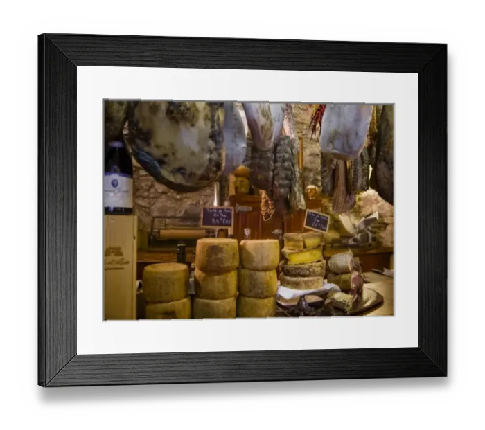 Framed Print : France, Corsica. Local cheeses and charcuterie (cured meats) at shop in Calvi offering Framed Print : France, Corsica. Local cheeses and charcuterie (cured meats) at shop in Calvi offering