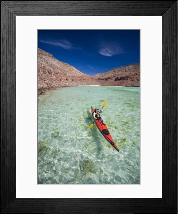 Framed Print : Mexico, Baja, Sea of Cortez. Sea kayaker paddles a bay on Espiritu Santo. (MR) Framed Print : Mexico, Baja, Sea of Cortez. Sea kayaker paddles a bay on Espiritu Santo. (MR)