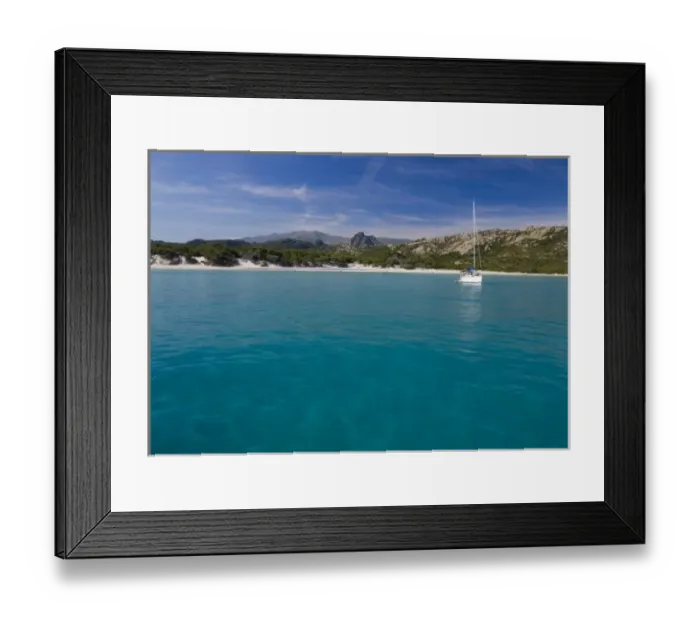 Framed Print : France, Corsica. Sailboat anchored in clear water off white sand of Saleccio Beach Framed Print : France, Corsica. Sailboat anchored in clear water off white sand of Saleccio Beach
