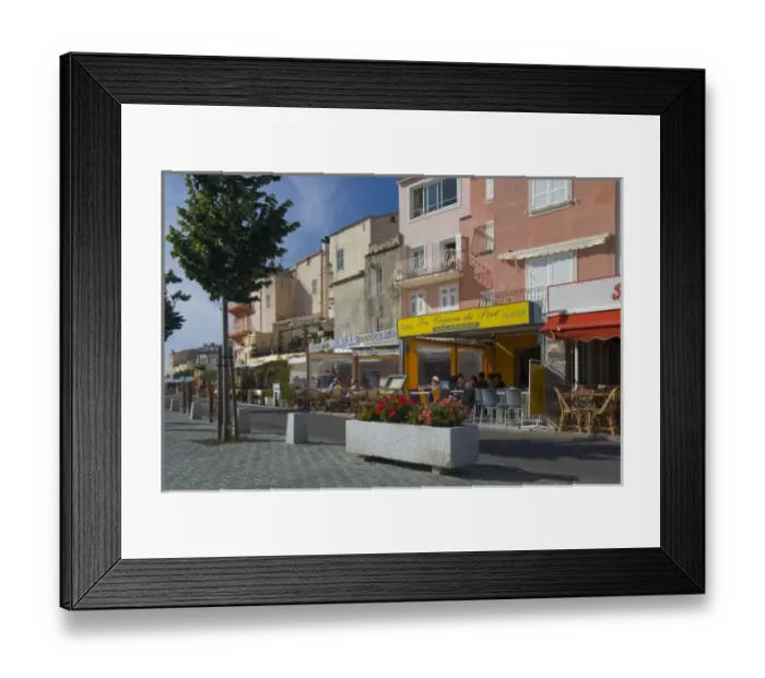 Framed Print : France, Corsica. Waterfront cafes and apartments in St. Florent Framed Print : France, Corsica. Waterfront cafes and apartments in St. Florent