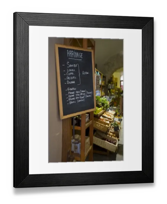 Framed Print : France, Corsica. Sign listing arrivals at market in St. Florent Framed Print : France, Corsica. Sign listing arrivals at market in St. Florent