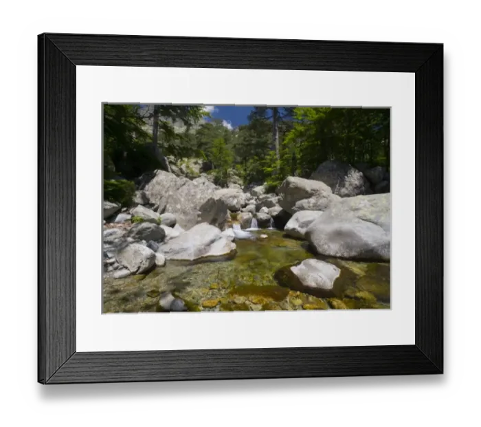 Framed Print : France, Corsica. Clear water and granite below forest of beech and laricio pine trees Framed Print : France, Corsica. Clear water and granite below forest of beech and laricio pine trees
