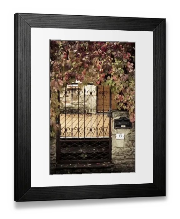 Framed Print : France, Midi-Pyrenees Region, Tarn Department, Cordes-sur-Ciel, gate with autumn foliage