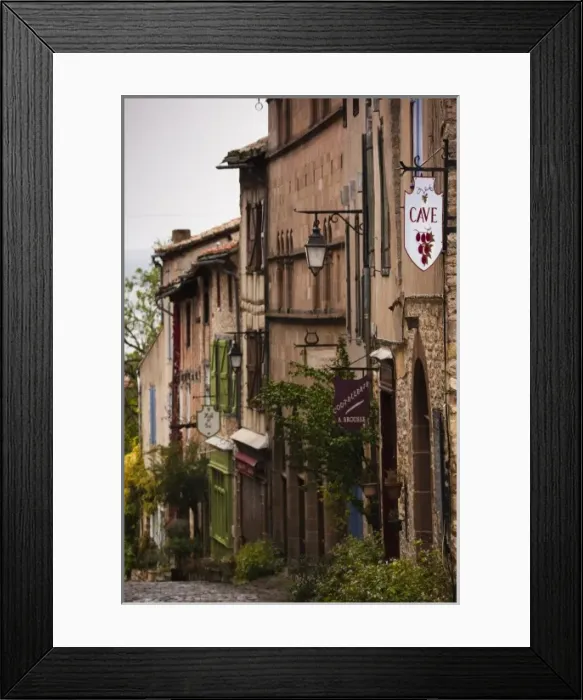 Framed Print : France, Midi-Pyrenees Region, Tarn Department, Cordes-sur-Ciel, buildings along Grand Framed Print : France, Midi-Pyrenees Region, Tarn Department, Cordes-sur-Ciel, buildings along Grand