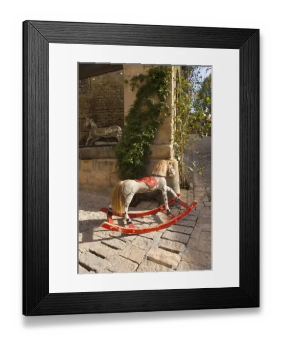 Framed Print : France, Aquitaine Region, Dordogne Department, Sarlat-la-Caneda, antique hobby-horse Framed Print : France, Aquitaine Region, Dordogne Department, Sarlat-la-Caneda, antique hobby-horse