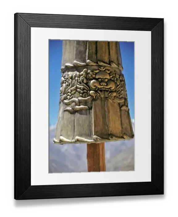 Framed Print : Asia, India, Ladakh, Karsha. A close-up of a strikingly carved brass figure hides the Himalayas Framed Print : Asia, India, Ladakh, Karsha. A close-up of a strikingly carved brass figure hides the Himalayas