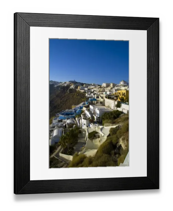 Framed Print : Santorini Greece and the beautiful white buildings on the mountain cliffs of Framed Print : Santorini Greece and the beautiful white buildings on the mountain cliffs of