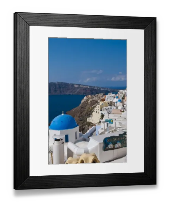 Framed Print : Looking down the steep cliffs of white buildings in beautiful Oia in Santorini in Framed Print : Looking down the steep cliffs of white buildings in beautiful Oia in Santorini in
