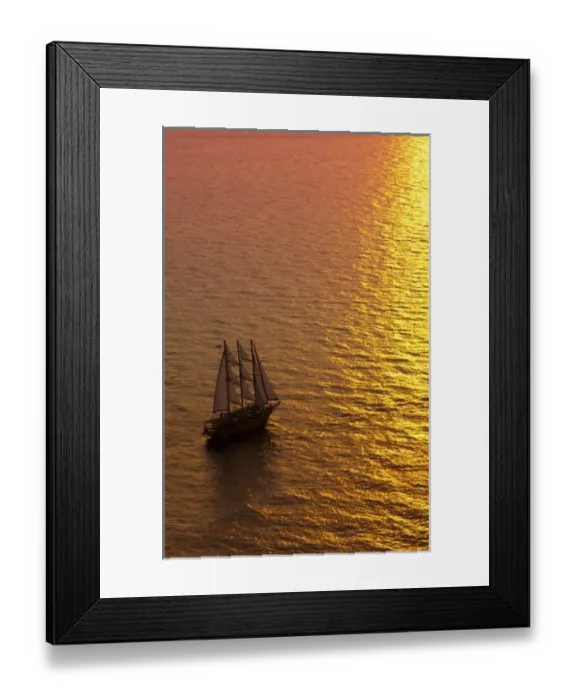 Framed Print : Big masked sailboat sailing in sunset of beautiful Oia in Santorini Greece in Greek