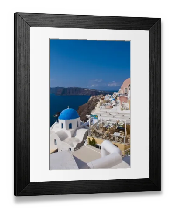 Framed Print : Looking down the steep cliffs of white buildings in beautiful Oia in Santorini in Framed Print : Looking down the steep cliffs of white buildings in beautiful Oia in Santorini in