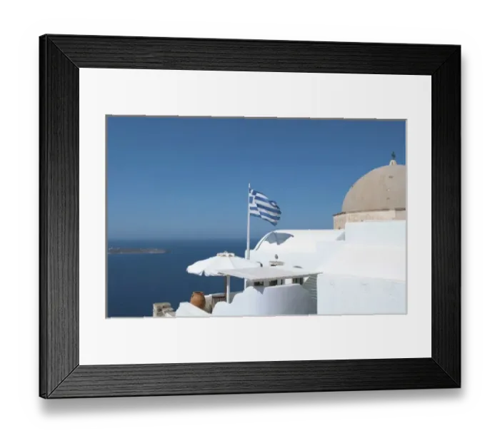 Framed Print : Greek flag flying on porch of white home on steep clifees of Fira in Santorini in Framed Print : Greek flag flying on porch of white home on steep clifees of Fira in Santorini in