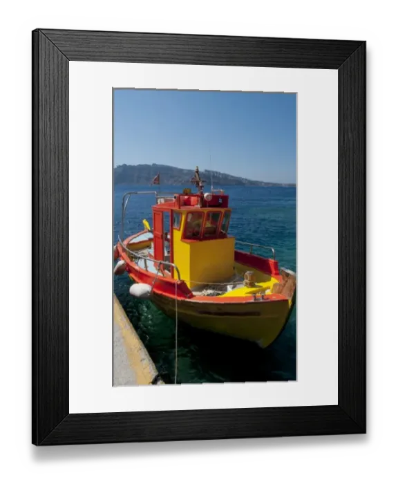 Framed Print : Colorful yellow fishing boat in fishing village at bottom of Oia in Santorini in Framed Print : Colorful yellow fishing boat in fishing village at bottom of Oia in Santorini in