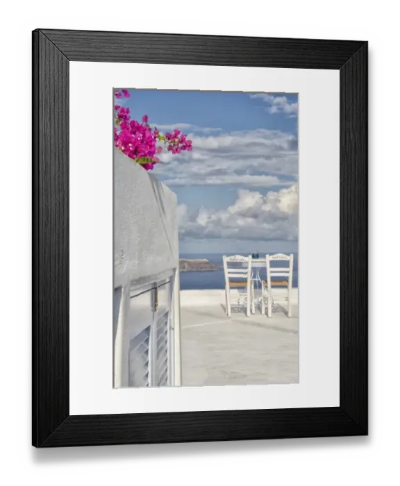 Framed Print : Two lonely romantic chairs on balcony with sky in Fira in Santorini Greece in Greek Framed Print : Two lonely romantic chairs on balcony with sky in Fira in Santorini Greece in Greek