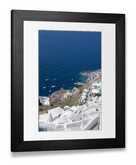 Framed Print : Looking down at fishing village in Oia in Santorini Greece in the Greek Islands Framed Print : Looking down at fishing village in Oia in Santorini Greece in the Greek Islands