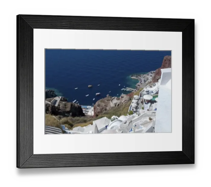Framed Print : Looking down at fishing village in Oia in Santorini Greece in the Greek Islands Framed Print : Looking down at fishing village in Oia in Santorini Greece in the Greek Islands