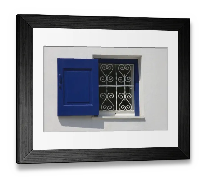 Framed Print : Greece, Mykonos, Hora. Open window with blue shutter and iron grill contrast with white wall