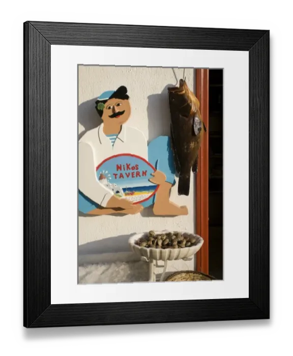 Framed Print : Greece, Mykonos, Hora. Sign at entrance to Nikos Tavern beside hanging fish Framed Print : Greece, Mykonos, Hora. Sign at entrance to Nikos Tavern beside hanging fish
