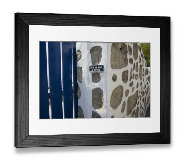 Framed Print : Greece, Mykonos. Gate and stone wall with caution notice for tourists, This is not a hotel Framed Print : Greece, Mykonos. Gate and stone wall with caution notice for tourists, This is not a hotel