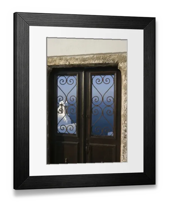 Framed Print : Greece, Santorini, Thira, Oia. Church tower seen through iron grill of door with sea in background