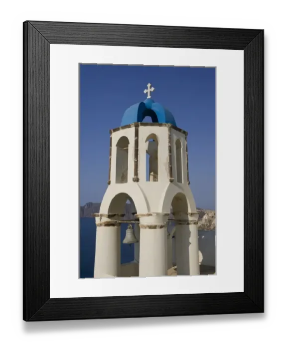 Framed Print : Greece, Santorini, Thira, Oia. Greek Orthodox church bell tower with cross overlooking sea