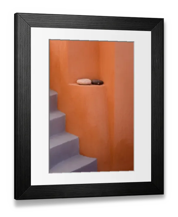 Framed Print : Greece, Santorini, Thira, Oia. Grey stairs contrast with orange wall and two rocks on ledge Framed Print : Greece, Santorini, Thira, Oia. Grey stairs contrast with orange wall and two rocks on ledge