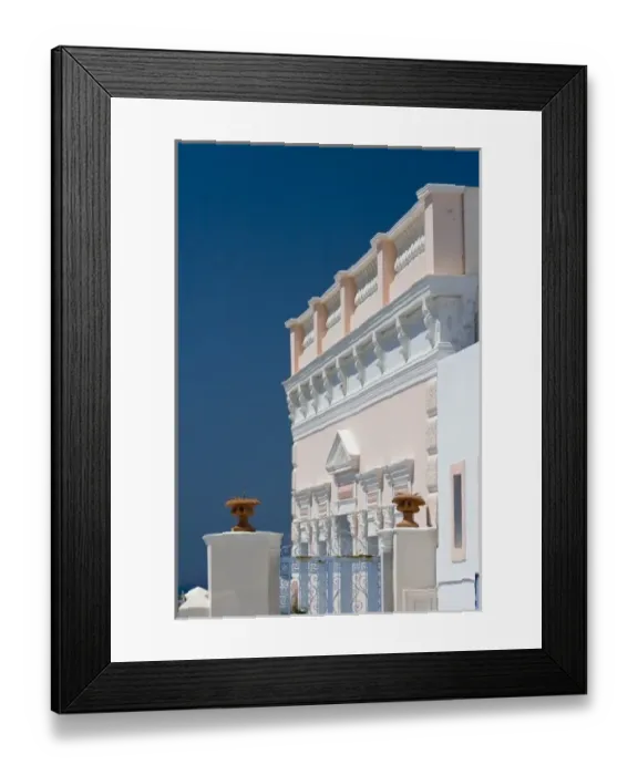Framed Print : Greece, Santorini, Thira, Oia. Ornate pink villa facade against clear blue sky Framed Print : Greece, Santorini, Thira, Oia. Ornate pink villa facade against clear blue sky