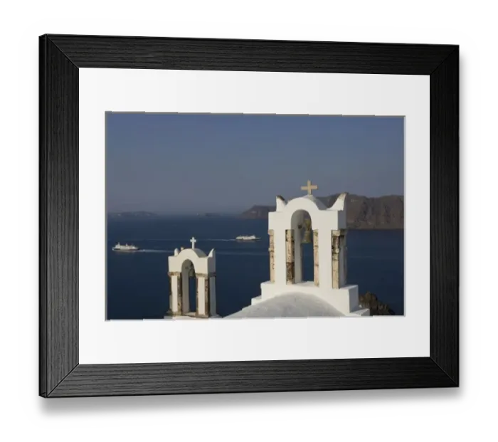 Framed Print : Greece, Santorini, Thira, Oia. Two Greek Orthodox church bell towers and two Hellenic