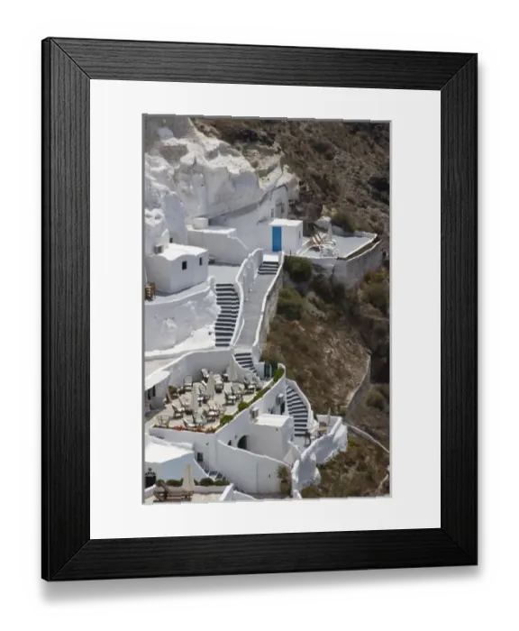 Framed Print : Greece, Santorini, Thira, Oia. Stairs connecting different levels of a large white