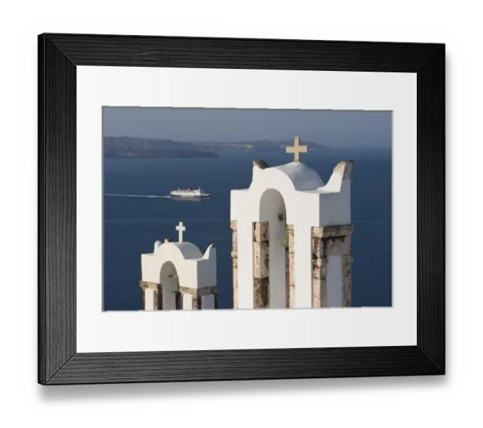 Framed Print : Greece, Santorini, Thira, Oia. Two Greek Orthodox church bell towers and a Hellenic