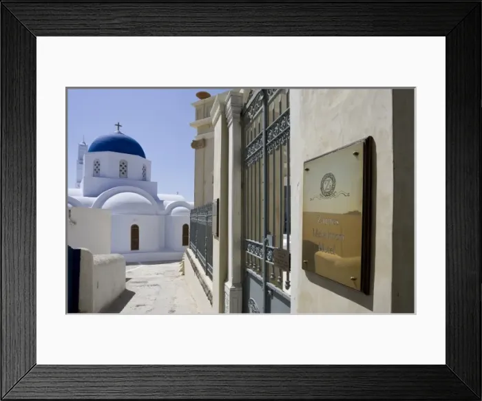 Framed Print : Greece, Santorini. Zannos Melathron Hotel with Greek Orthodox church in background Framed Print : Greece, Santorini. Zannos Melathron Hotel with Greek Orthodox church in background