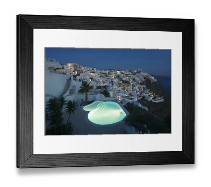 Framed Print : Greece, Santorini, Firostefani. Early evening view of cliffside villas with lit swimming Framed Print : Greece, Santorini, Firostefani. Early evening view of cliffside villas with lit swimming