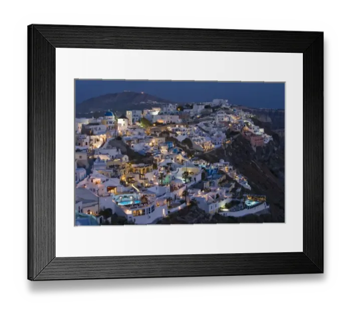 Framed Print : Greece, Santorini, Firostefani. Early evening view of cliffside villas with lights coming Framed Print : Greece, Santorini, Firostefani. Early evening view of cliffside villas with lights coming
