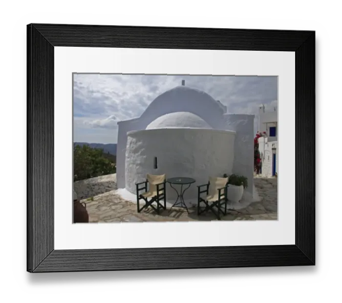 Framed Print : Greece, Amorgos, Chora. A cafe expands to a neighboring Greek Orthodox church
