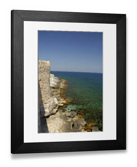 Framed Print : Europe, Greece, Peloponnese, Monemvasia. Medieval city walls go right up to the clear Framed Print : Europe, Greece, Peloponnese, Monemvasia. Medieval city walls go right up to the clear