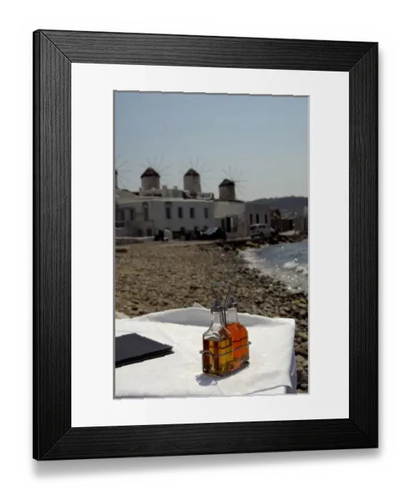 Framed Print : Europe, Greece, Mykonos. Waterfront cafe, historic windmills in distance Framed Print : Europe, Greece, Mykonos. Waterfront cafe, historic windmills in distance