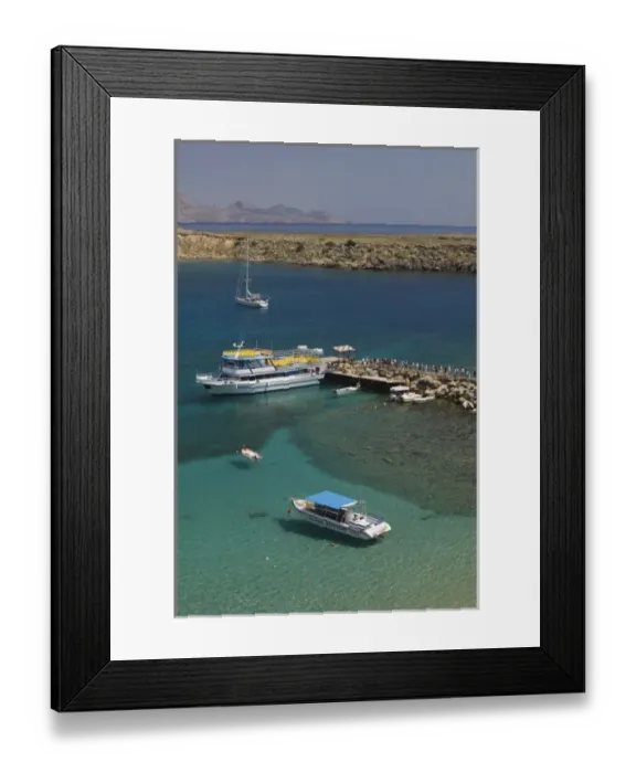 Framed Print : GREECE-Dodecanese Islands-RHODES-Lindos: Lindos Harbor- Tour boat with visitors Framed Print : GREECE-Dodecanese Islands-RHODES-Lindos: Lindos Harbor- Tour boat with visitors