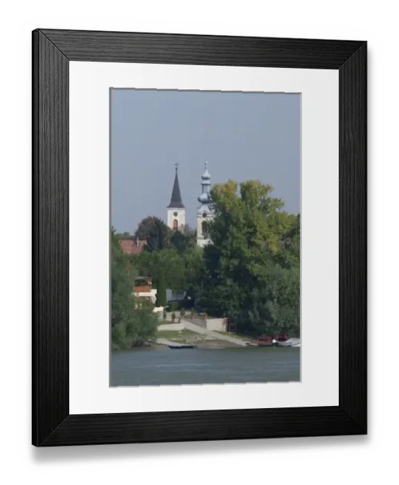 Framed Print : Hungary. Danube River view near Kalocsa. Typical waterfront village with clock tower