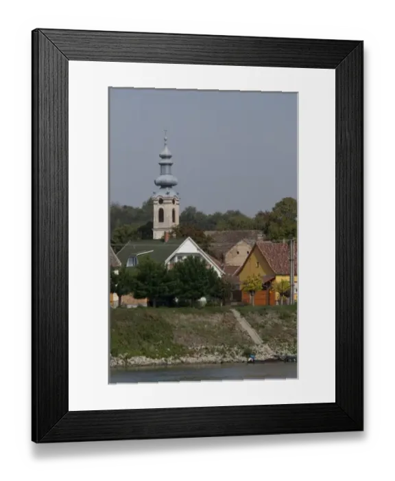 Framed Print : Hungary. Danube River view near Kalocsa. Typical waterfront village with clock tower Framed Print : Hungary. Danube River view near Kalocsa. Typical waterfront village with clock tower