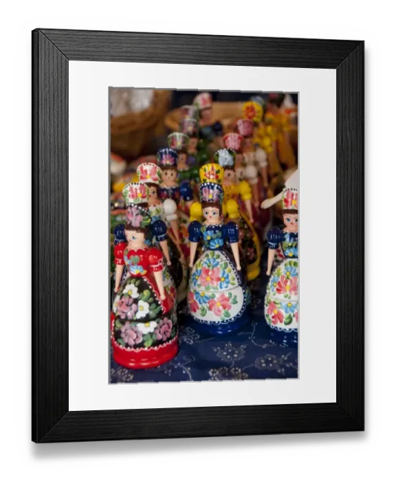Framed Print : Hungary, Kalocsa. Typical Hungarian souvenirs, wooden dolls in traditional costume Framed Print : Hungary, Kalocsa. Typical Hungarian souvenirs, wooden dolls in traditional costume