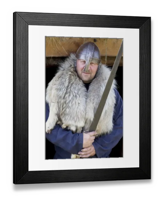 Framed Print : Reenactor as sword-wielding Viking Erik the Red, the father of Leif Eriksson Framed Print : Reenactor as sword-wielding Viking Erik the Red, the father of Leif Eriksson