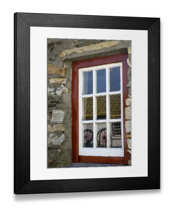 Framed Print : Ireland, Gleann Cholm Chille. Reflection of wagon wheels in a red- trimmed window Framed Print : Ireland, Gleann Cholm Chille. Reflection of wagon wheels in a red- trimmed window