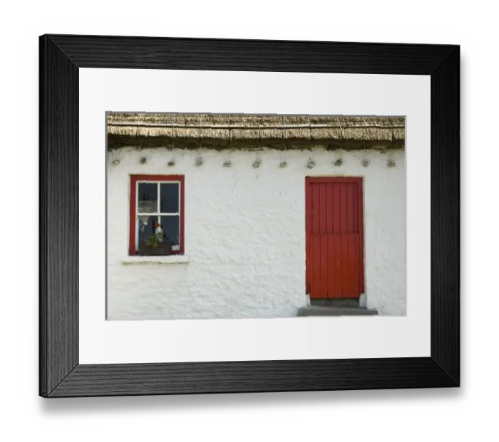 Framed Print : Ireland, Gleann Cholm Chille. Details of a thatched-roof cottage with a red door