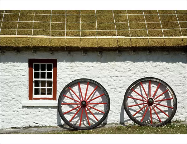 Ireland, Gleann Cholm Chille. Replica of a thatched-roof cottage from the 1850s with