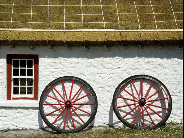 Ireland, Gleann Cholm Chille. Replica of a thatched-roof cottage from the 1850s with