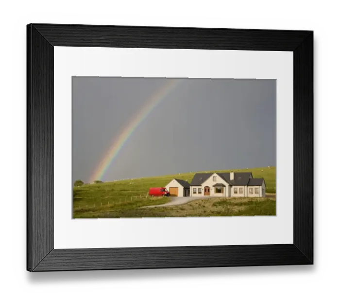 Framed Print : Europe, Ireland, Donegal. Afternoon rainbow arcs across the sky over a house in