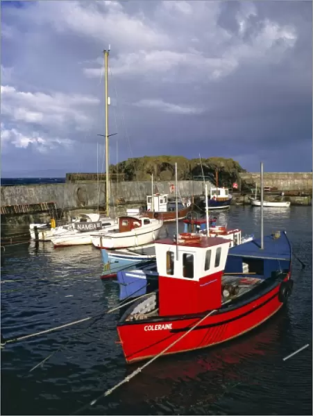 Northern Ireland, County Antrim, Portrush. Colorful boats are moored at the harbor at Portrush, Co