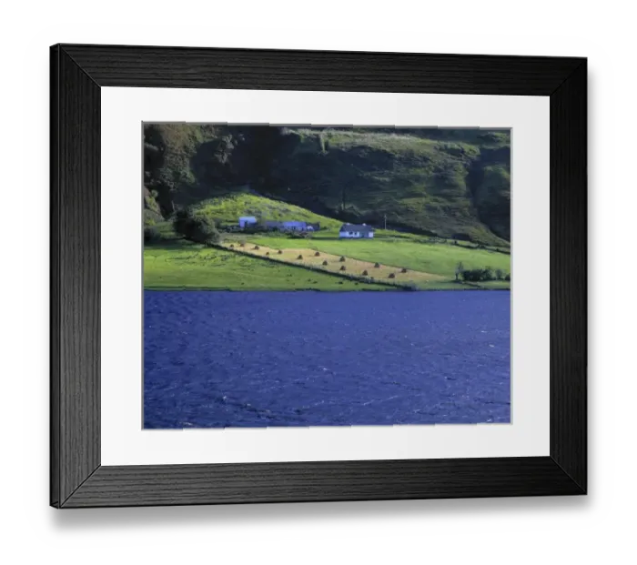 Framed Print : Europe, Ireland, Glenties. A small farm near Glenties is bordered by vivid blue water Framed Print : Europe, Ireland, Glenties. A small farm near Glenties is bordered by vivid blue water