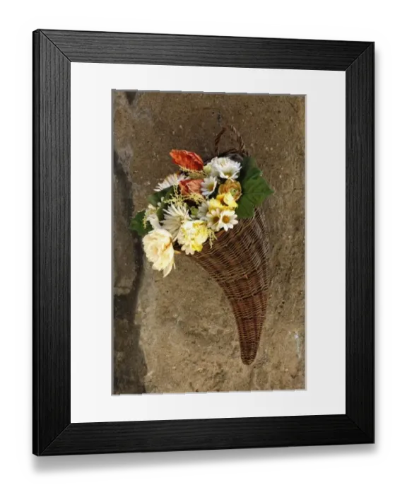 Framed Print : Basket of flowers on wall, Tuscany Framed Print : Basket of flowers on wall, Tuscany
