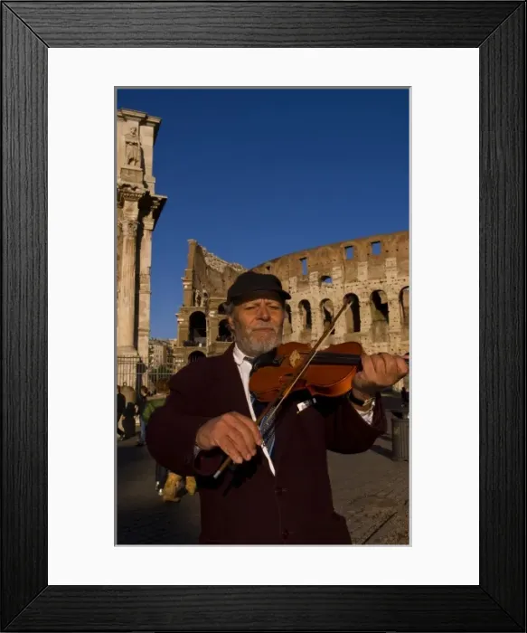 Framed Print : Local man playing violin at famous Colosseum in Rome Italy Landmark Monument in Europe Framed Print : Local man playing violin at famous Colosseum in Rome Italy Landmark Monument in Europe
